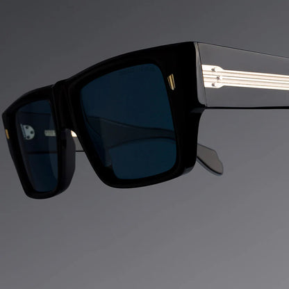 Black sunglasses with a reflective surface on a gray background